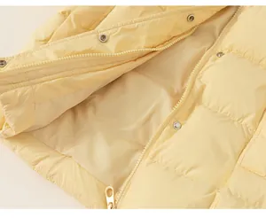 Close-up of high-quality zipper, metallic snaps and neat stitching on kid's down jacket