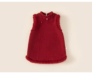 Close-up of red tweed girl's vest with faux fur trim, gold glitter and pearl button details
