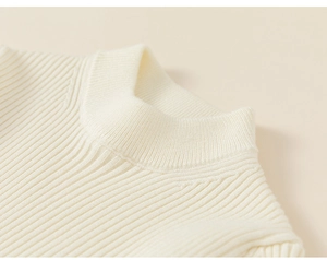 Detail shot of cream white ribbed knit collar and shoulder with fine stitching texture