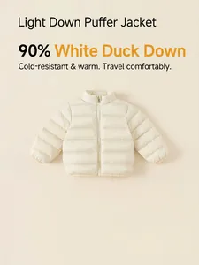 Kids lightweight reversible 90% white duck down puffer jacket in cream white color