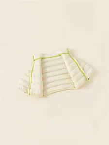 Reversible kids lightweight white duck down vest in cream white with neon green trim
