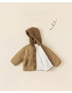 Detailed view of kids thickened fleece lining and quilted wave texture on warm winter jacket