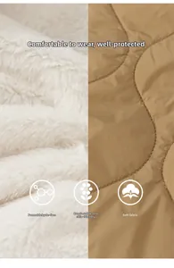 Detailed view of soft white faux fur lining and khaki quilted fabric with diamond stitching