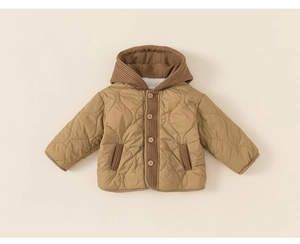 Detail of heart-quilted kids hooded jacket with wooden buttons and warm fleece lining
