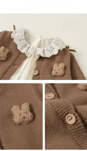 Detail of girls knit cardigan with plush bunny applique and handmade wooden buttons