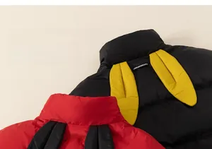Close-up of kids puffer jacket featuring 3D rabbit ears and a soft quilted texture