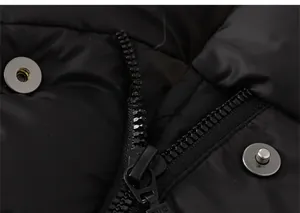 Detailed macro view of high-quality metal zipper and snap buttons on black quilted puffer jacket