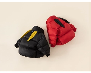 Close-up of winter puffer jackets for kids featuring adorable long bunny ears on hoods
