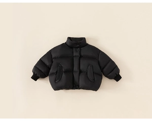 Close-up of black kids puffer jacket featuring stand collar and ribbed knit cuffs