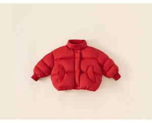Close-up of a kids' red short puffer jacket with snap buttons and elastic ribbed cuffs