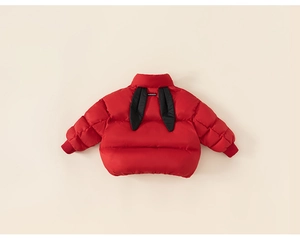 Detail of red kids down jacket showing windproof cuffs and black rabbit ear decoration