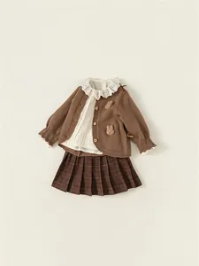 3-piece autumn girls' outfit with brown knit cardigan, lace blouse, and plaid pleated skirt
