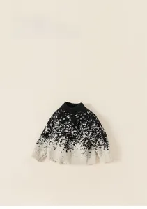 Close-up of contrast knit sweater with gradient speckled jacquard pattern for kids