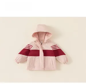 Detail of a pink hooded children's jacket with dark red stripe and athletic shoulder bands