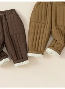 Detailed view of kids thickened quilted winter trousers with warm fleece lining