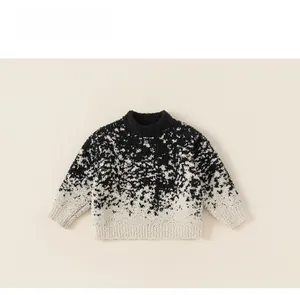 Detail view of children's knit sweater featuring black and white gradient fuzzy texture