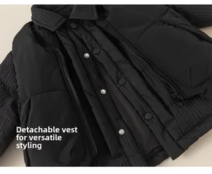 Detail der schwarzen Kinderwinterjacke mit abnehmbarer Weste, Reißverschluss und Druckknopf