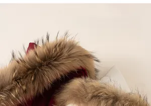 Detail of soft fluffy faux fur collar on wine red winter parka for girls