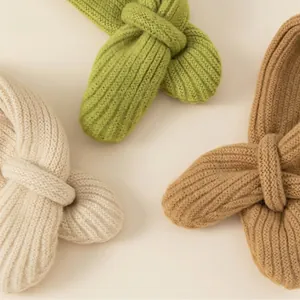 Knitted kids winter scarf set featuring bow knot design in cream, green and camel tones
