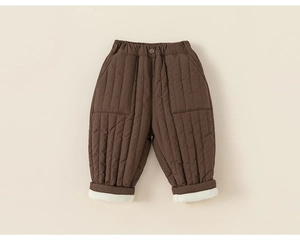 Detailed view of quilted winter trousers with elastic waist and white fleece lining
