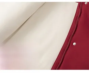 Detailed macro view of heavy red coat with white faux lamb wool lining and metal buttons