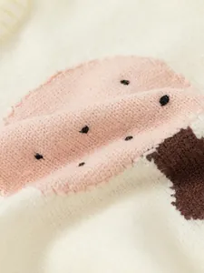 Cream knit sweater for girls featuring pink mushroom jacquard pattern and soft texture