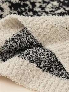 Kids warm black and white textured fleece sweater detail with soft fuzzy knit fabric
