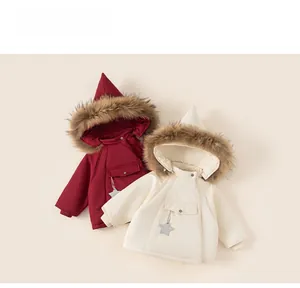 Detailed view of kids' winter hooded coats in crimson red and cream white with star tags