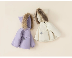 Close-up of children's hooded winter jacket featuring faux fur collar and star charms