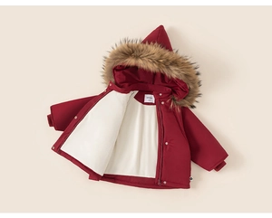 Close-up of deep red hooded children's winter coat with faux fur trim and cozy fleece lining