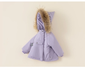 Close-up of kids winter hooded jacket with fluffy faux fur trim and star charm