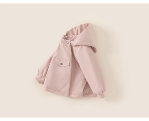 Detail view of pink hooded winter coat for girls showing ribbed cuffs and pocket