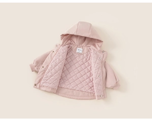 Detail of pink hooded girls jacket with quilted diamond lining and ribbed cuffs