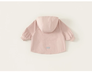 Detail view of pink girls hooded windbreaker back showing elastic cuffs and safety strip