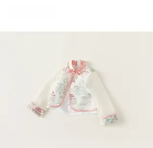 Detailed view of traditional Chinese style kids white silk blouse with pink stand collar