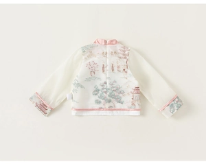 Detail of child Chinese style top showing back zipper and intricate landscape embroidery
