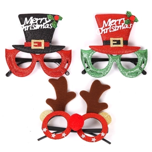 Three assorted Christmas party glasses with glitter top hats and reindeer antler designs