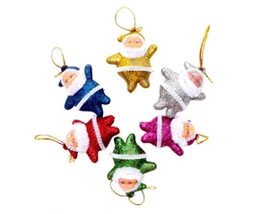 Detail view of six colorful glittery Santa Claus ornaments with gold hanging strings