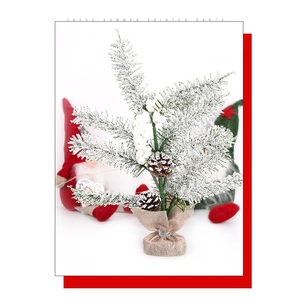 Mini snowy Christmas tree detail featuring natural pine cones and a burlap wrapped base