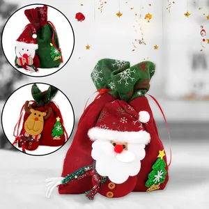 Detailed close-up of Christmas drawstring gift bags with 3D Santa and Reindeer designs