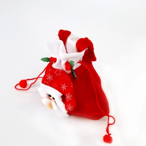 Red plush Christmas drawstring gift bag with 3D Santa Claus figure and soft white fur trim