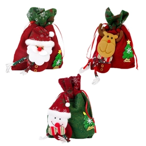 Three Christmas drawstring gift bags featuring 3D Santa, reindeer, and snowman designs