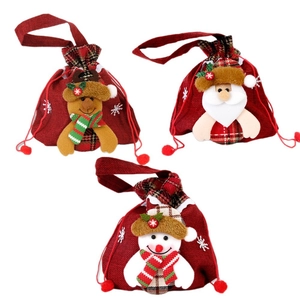 Three Christmas drawstring gift bags featuring Santa, snowman, and reindeer in burlap