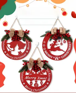 Detail of red hollow wooden Christmas sign with elk, bells, and plaid bow decorations