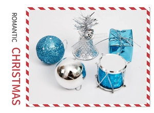 Blue and silver Christmas ornaments set with glitter balls, bells, and mini gift boxes