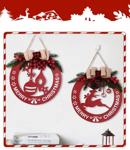 Detail of red hollow wooden Christmas signs with reindeer, bells and pine needles