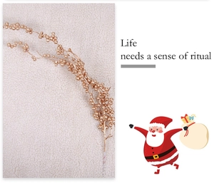 Detail of champagne gold artificial berry stem for festive Christmas tree and home decoration
