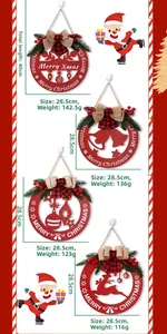 Close-up of wooden Christmas door plaques with hollow designs and pine decorations