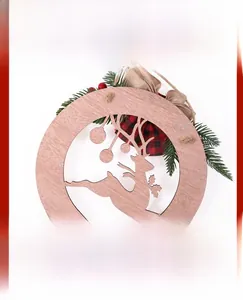 Detail of laser-cut wooden Christmas sign with reindeer motif and holiday berries