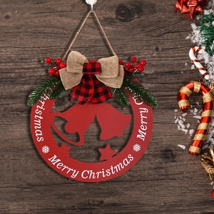 Red hollow wooden Christmas door sign with Merry Christmas text and pine accents
